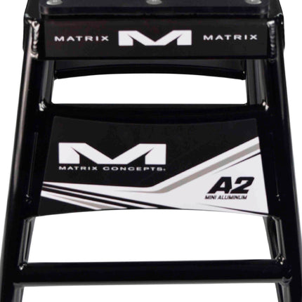Matrix Concepts Mini A2 Aluminum Stand  /Mass Depot Sticker Pack - Black | Lightweight 6063 Aircraft Aluminum Youth Motocross Bike Lift| 150 lb Capacity | Non-Slip Rubber Top & Compact 8" x 8" Base
